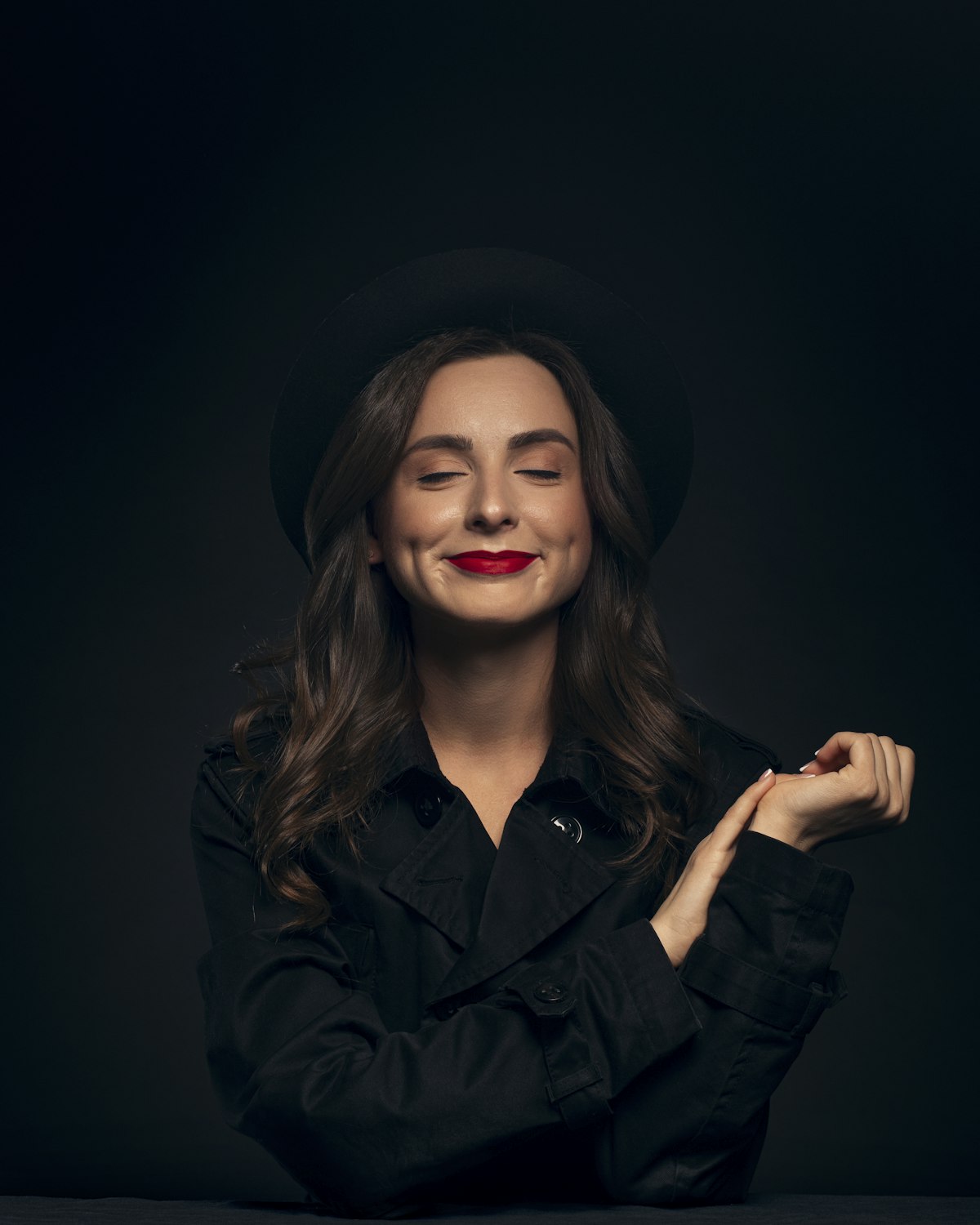 Editorial portrait of a woman in curated designer clothing and accessories