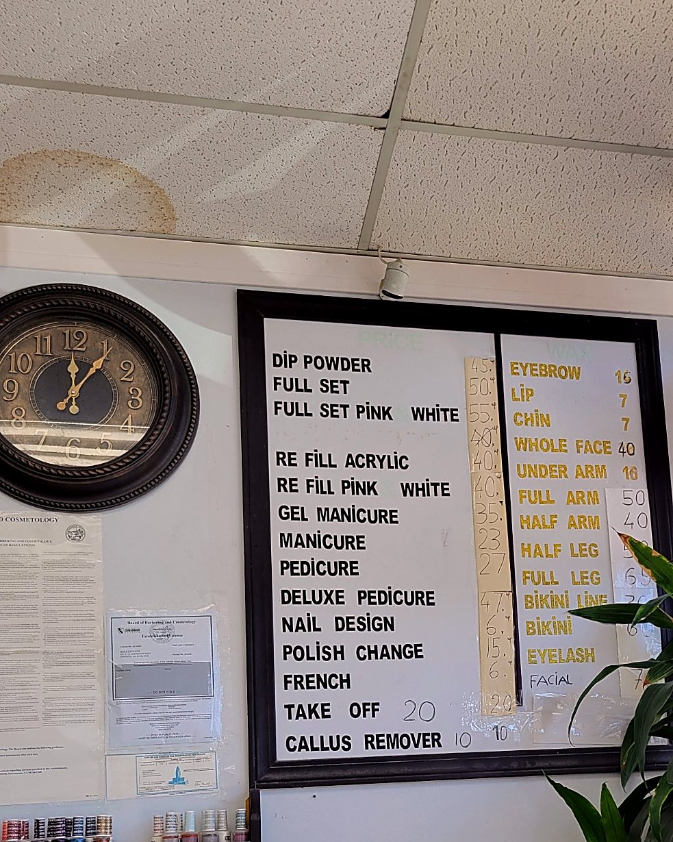 The price board on the wall at Nails Effects