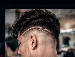 Textured crop with a low fade and a hard part line.