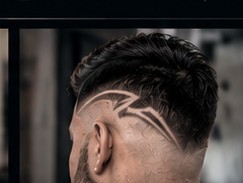 Skin fade with a freehand design.
