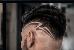 Skin fade with a freehand design.