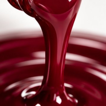 A glossy pour of deep wine-red gel polish