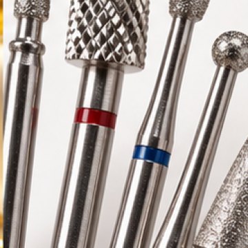 A fan of stainless steel nail drill bits