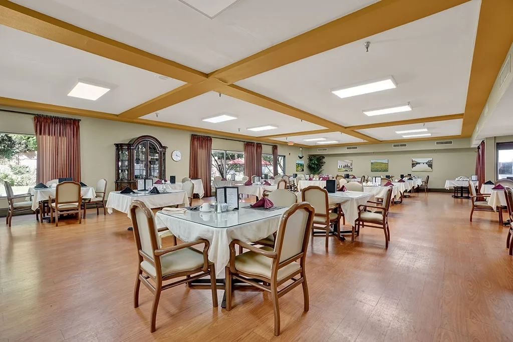 The dining hall with tables laid for service