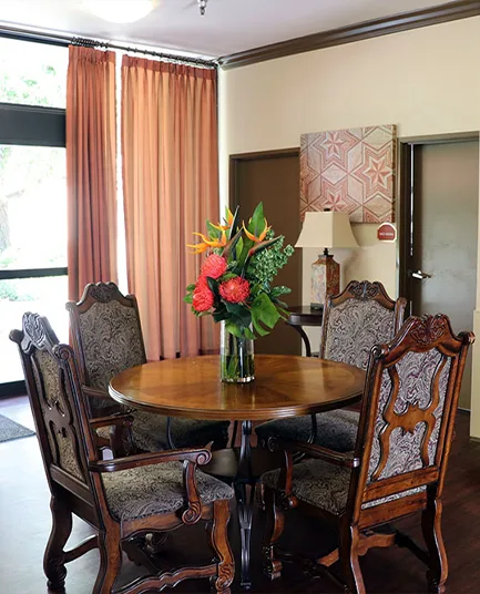 A dining table with fresh flowers