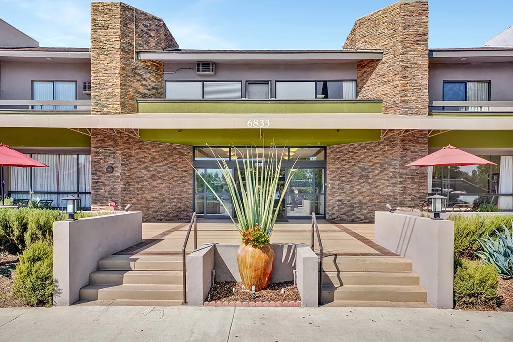 The Valley Silvertown community in West Hills, with shaded patio seating at the entrance