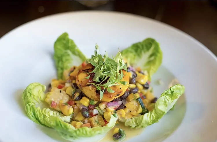 A crisp salad with fruit and greens