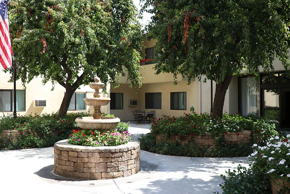 The fountain court with mature shade trees