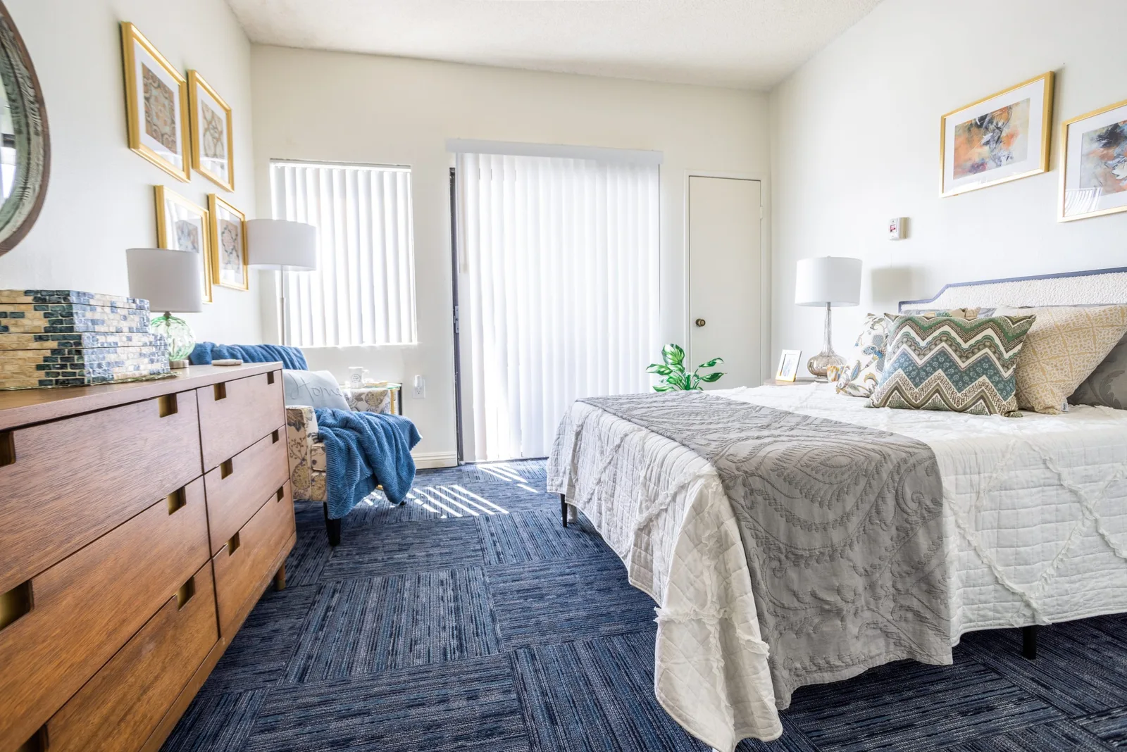 A resident bedroom at Valley Silvertown with dresser and artwork